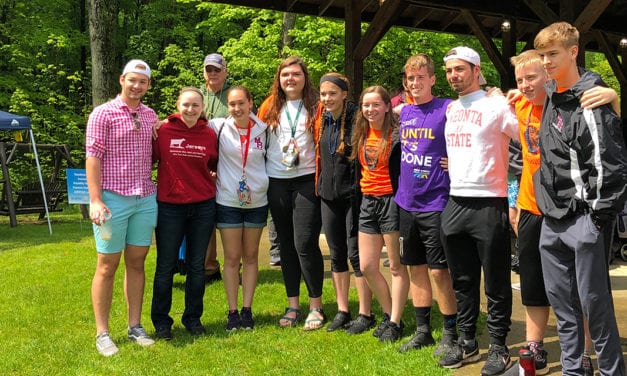 Students Support Classmate at Walk