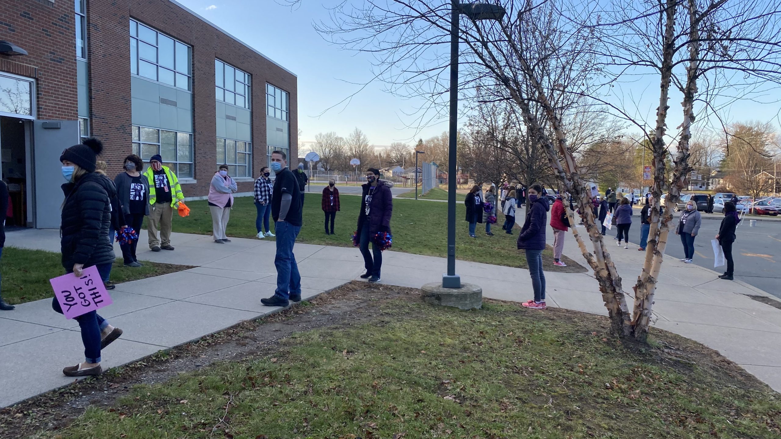 staff lining the walkway