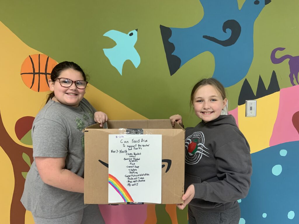 Castleton Elementary Students with canned food drive collection box