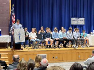 Students on stage at national junior honor society induction