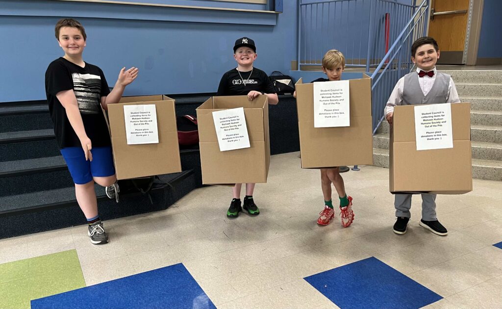 Members of Castleton Elementary School's Student Council. Each member is holding a Humane Society donation box.